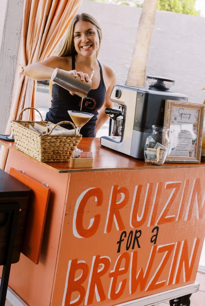 Diamond Quinones pouring a drink at the Cruizin for a Brewzin cart